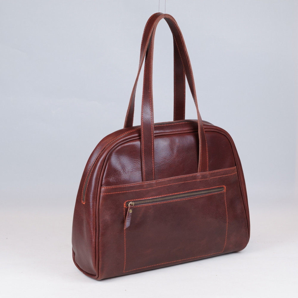 Carlota en color tabaco cosida en naranja