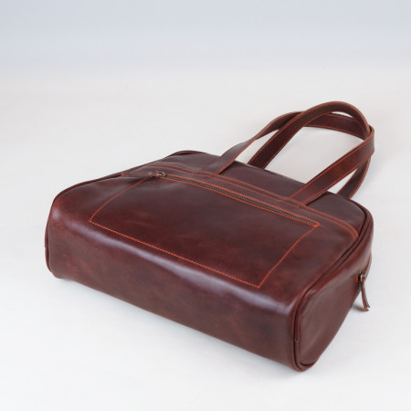 Carlota en color tabaco cosida en naranja